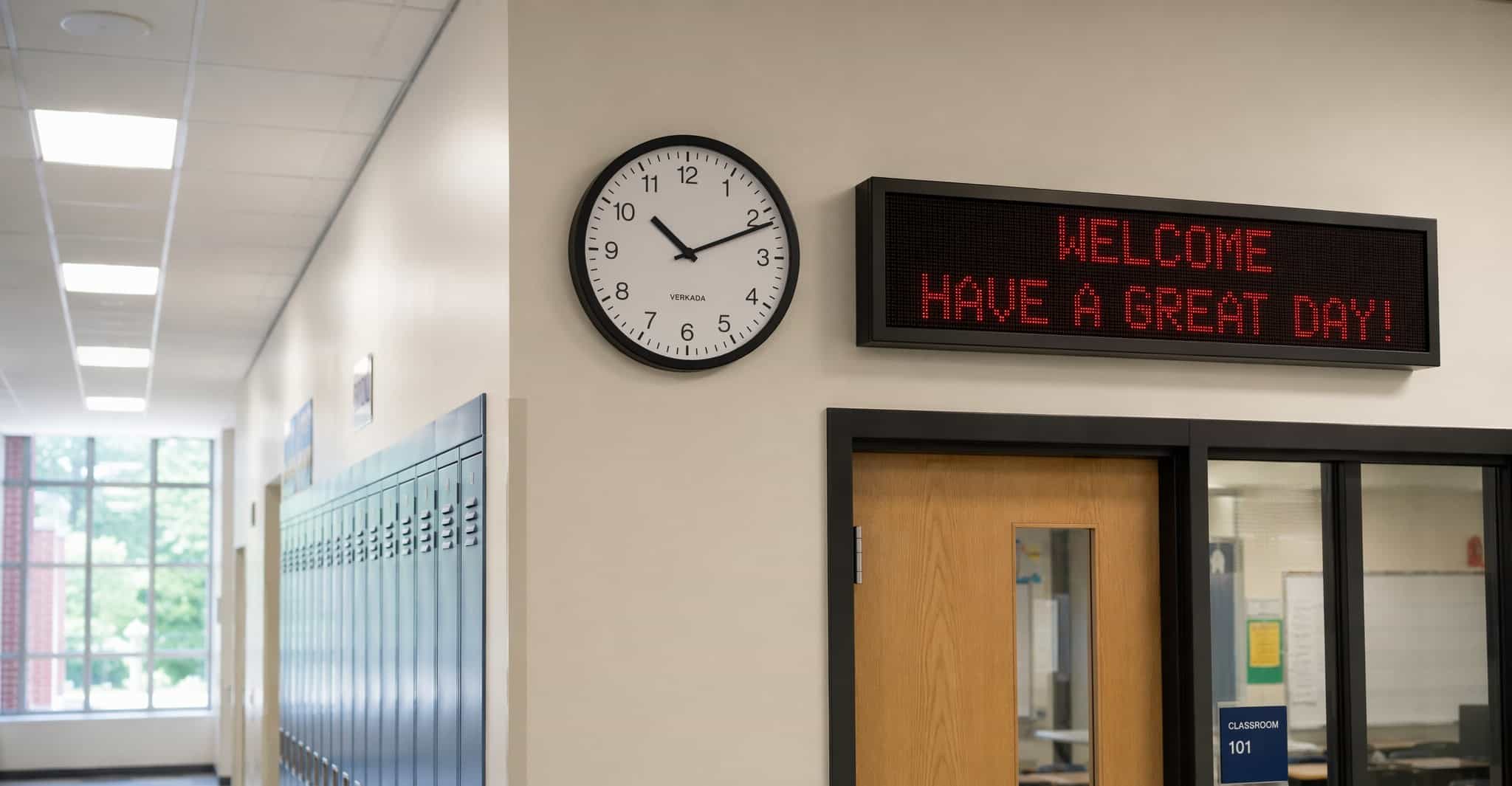 School hallway with clock and LED board